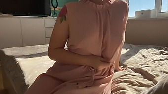 A Girl In A Pretty Pink Dress Explores Her Body